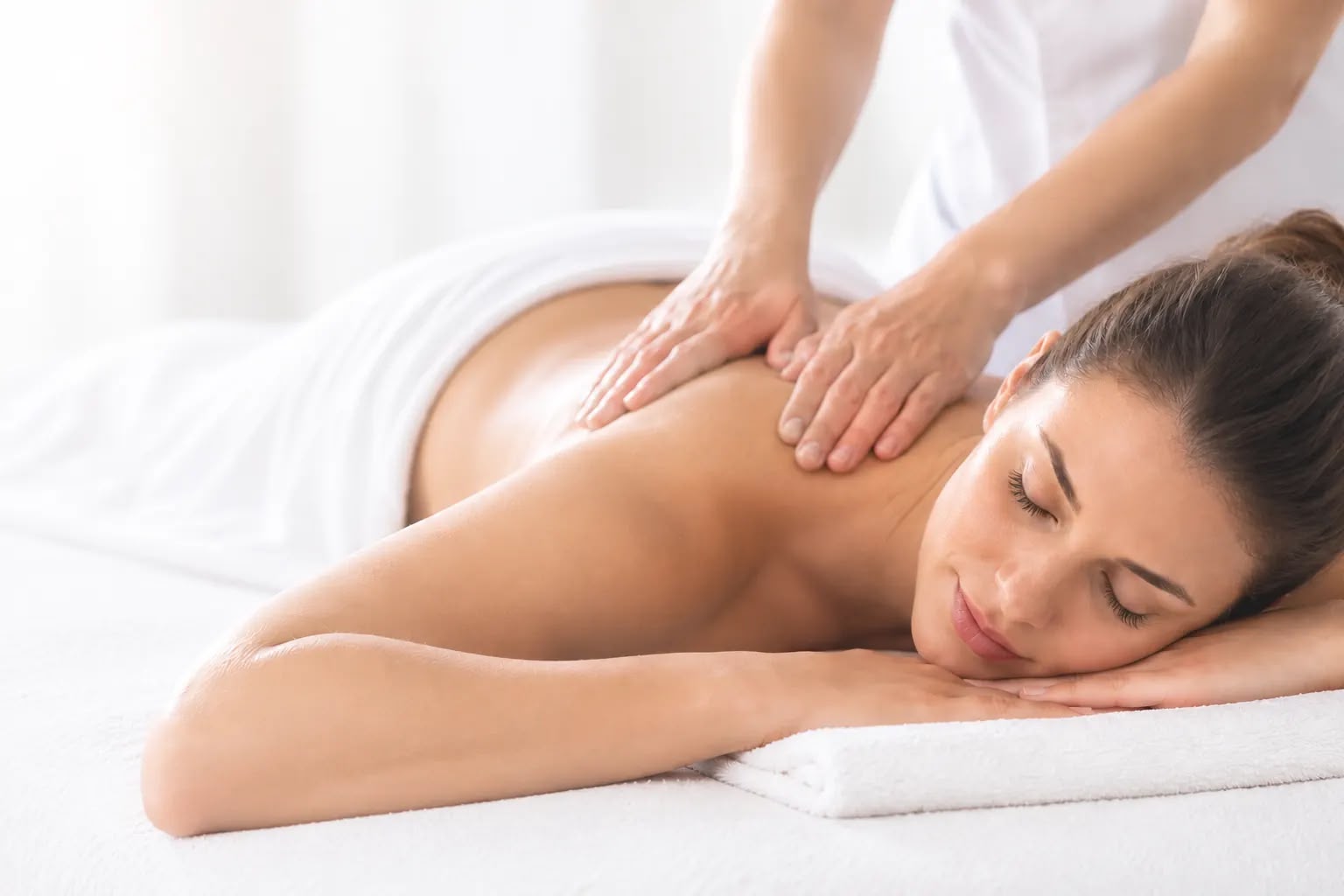 Therapist giving a back massage